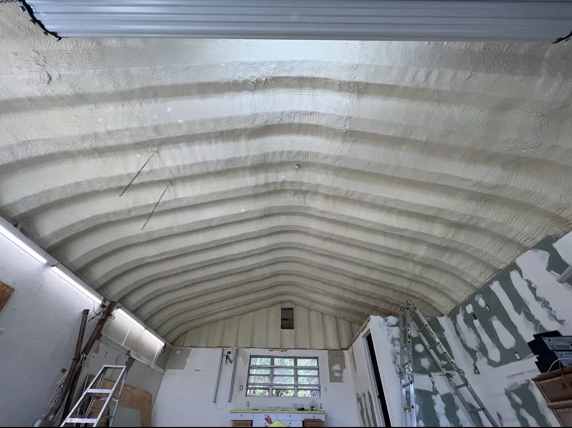 Spray polyurethane foam applied to the underside of a metal roof deck in Runnemede
